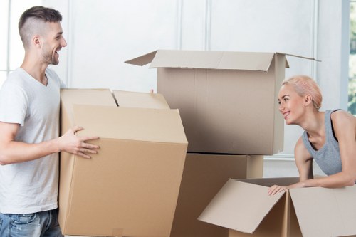 Packed moving boxes and furniture ready for transport in Park Royal